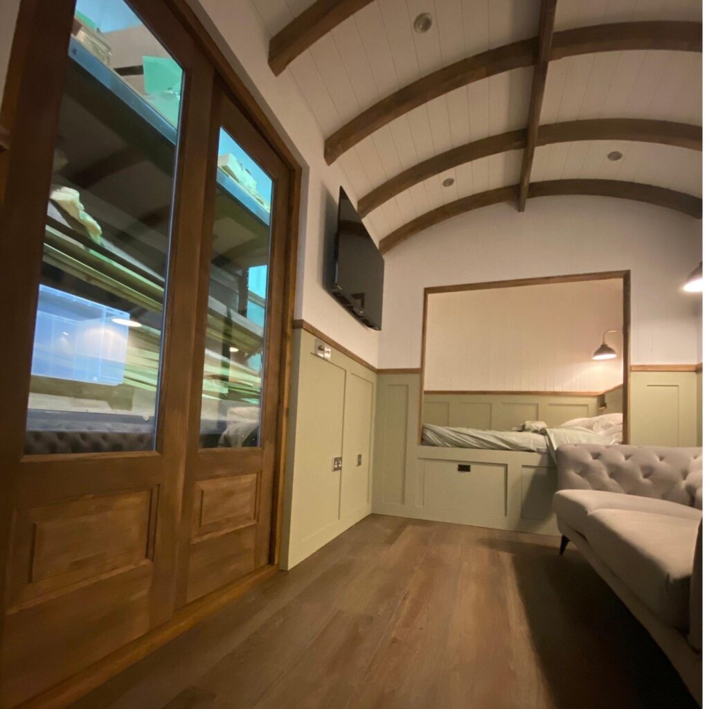 Interior view of shepherd hut using tongue and groove cladding