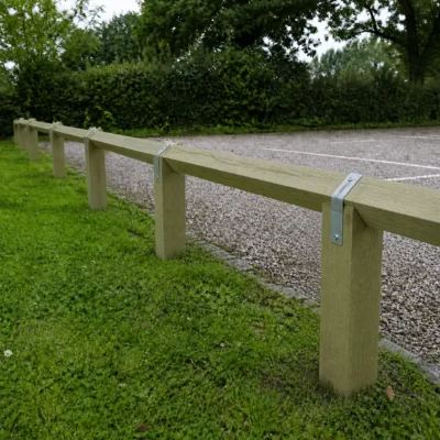 knee rail fencing featuring the bird mouth posts on a car park